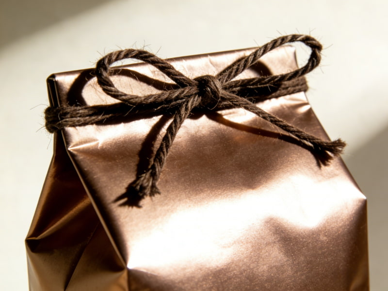 Coffee packaging with protective Spot UV layer providing scratch and UV resistance