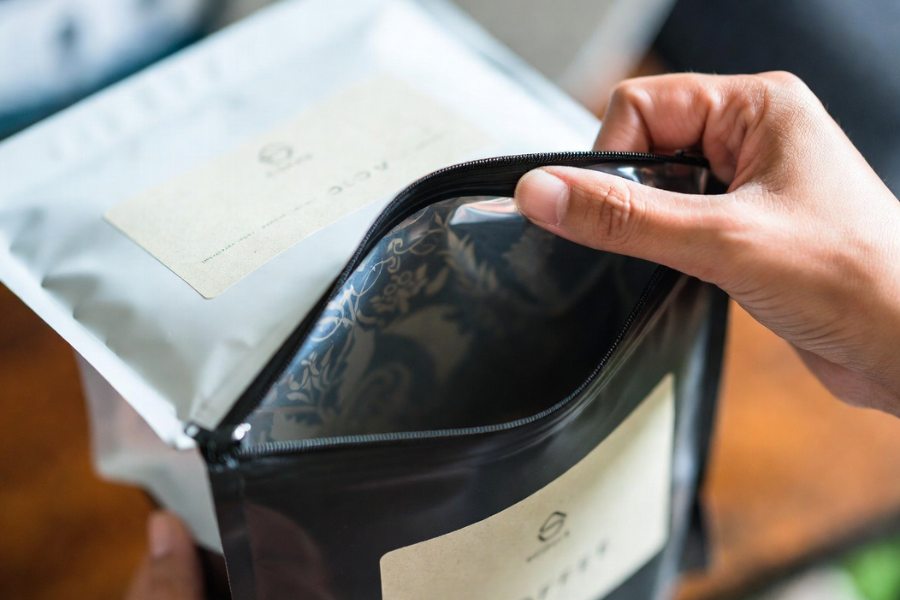 Unboxing experience highlighted in Coffee Bag Interior Wallpaper Guide for premium coffee packaging