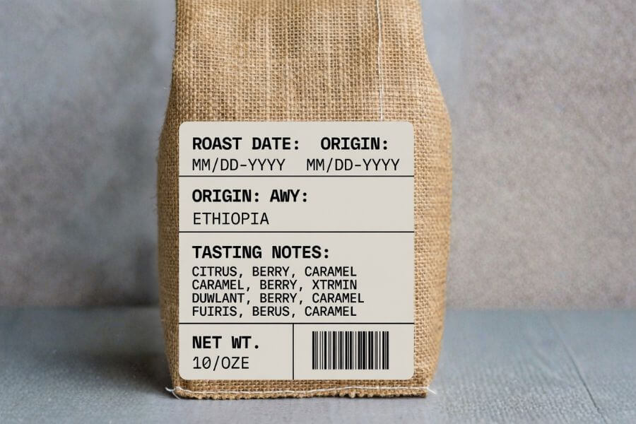 Coffee packaging label showing roast date origin tasting notes and net weight information on specialty coffee bag